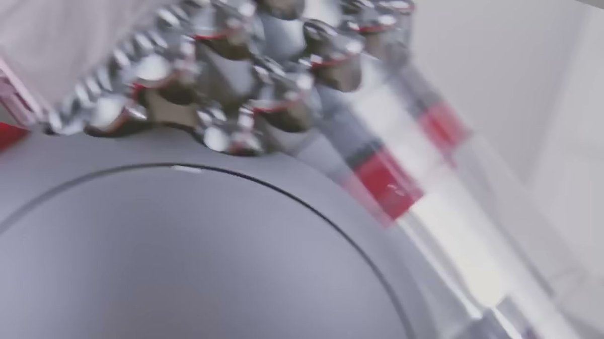 Close-up of Dyson Big Ball Multi Floor Canister's front wheels in motion